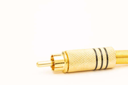 Golden stereo rca connector isolated above white background.