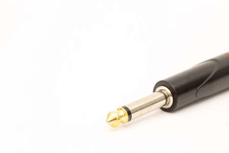 Audio 6.5 mm jack cable connector above white background.