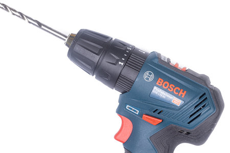 Belgrade - 09.02.2021. - Blue Bosch Jigsaw GSB 12V-30 above white background.のeditorial素材