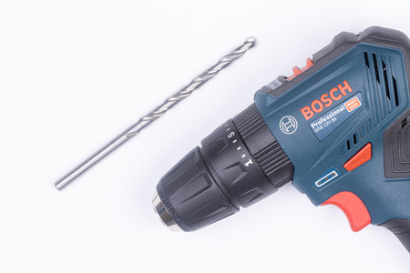 Belgrade - 09.02.2021. - Blue Bosch Jigsaw GSB 12V-30 above white background.のeditorial素材