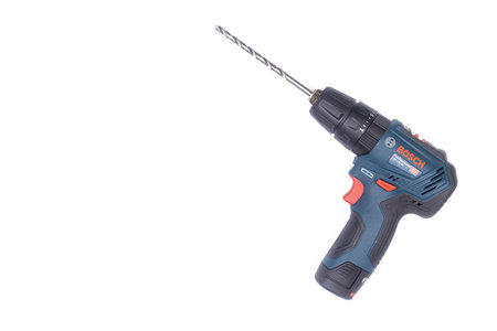 Belgrade - 09.02.2021. - Blue Bosch Jigsaw GSB 12V-30 above white background.のeditorial素材