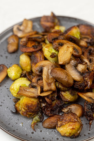 Cooked Brussel Sprouts with Mushrooms and served on the plate.の写真素材