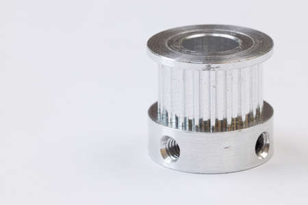 Aluminum pulley for cnc machines above white background.の写真素材