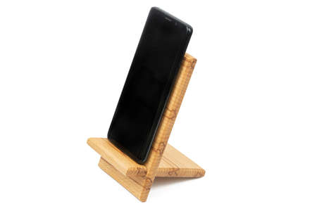 Wooden Phone Holder isolated above white background.の写真素材