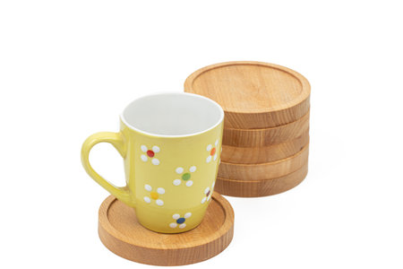 Round wooden coasters isolated above white background.の写真素材