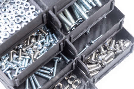 Boxes full with nuts and bolts. Workshop concept with tool boxの写真素材