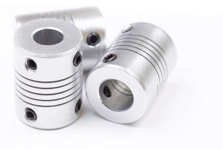 Aluminum flexible cnc shaft couplings isolated above white background.の写真素材