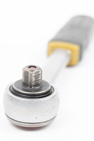 Close-up ratchet wrench. Professional tool. Isolated on a black backgroundの写真素材
