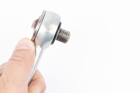 Close-up ratchet wrench. Professional tool. Isolated on a black backgroundの写真素材