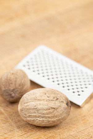 Nutmeg isolated. Whole nut and nutmeg powder isolated on white backgroundの写真素材