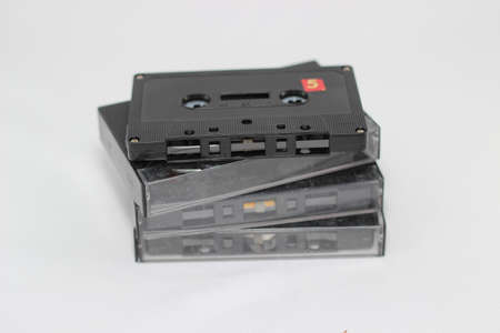 old vintage audiotapes on white backgroundの写真素材