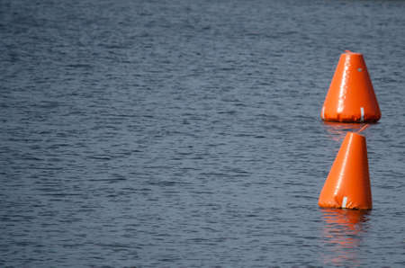 orange buoy on the pondの写真素材