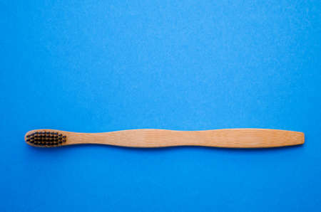 bamboo toothbrush on blue background.の写真素材