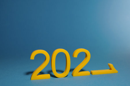 Concept of ideas for creativity and inspiration 2021. 2021 numbers cast shadows on blue background