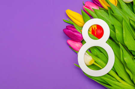 Womens Day, March 8, congratulations, flowers on a colored background, place for text. Suitable for advertising, postcards, congratulations.Copy spaceの写真素材