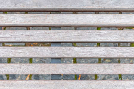 Old boards. Close-up of worn and weathered planks on a bench. As a background for a billboard,...