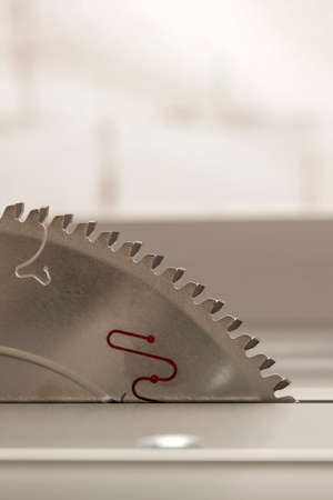 Sawing machine for wood. Saw blade. Circular saw blade on a woodworking machine. Circular saw maintenance and adjustmentの写真素材