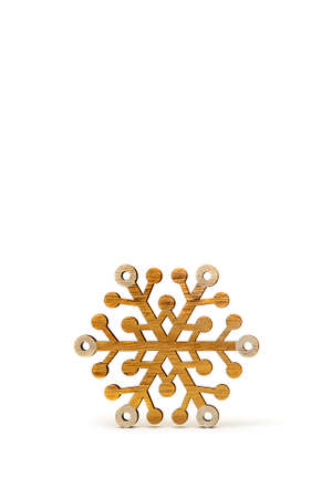 Snowflake on a white background. Wooden snowflakes cast shadow on white isolated background....