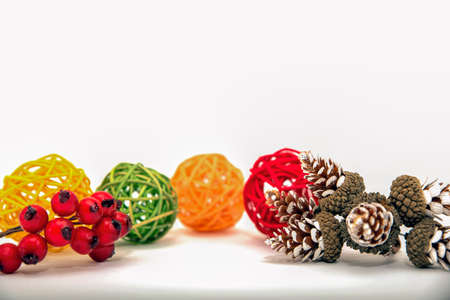 Christmas banner, isolate on white, cones and red berries are laid out on a white background. For print, postcard, design with place for text.の写真素材