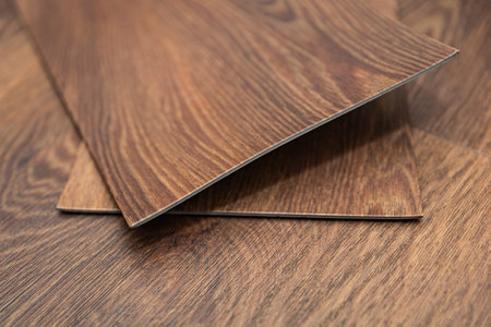 PVC vinyl floor. Vinyl floors. The swatches are brown with a woody texture. Copy spaceの写真素材