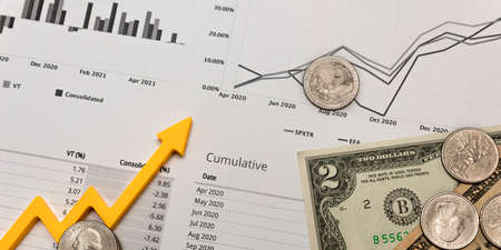 investment report, financial quarterly report, money on a printed sheet of a quarterly report and...