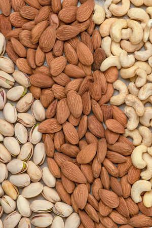 Nuts background, top view. The natural background is made from different varieties of nuts