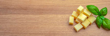 Cheese background. Assortment of different types of cheese on a wooden background.Place for textの写真素材