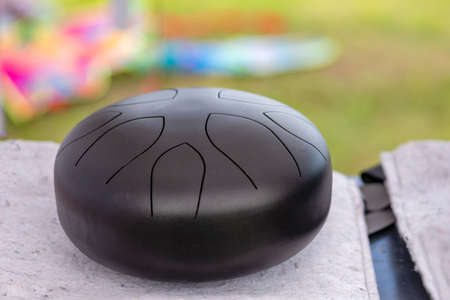 Steel tongue, drum. Singing bowl, steel drum and drumsticks. Instrument for sound wave therapy and...