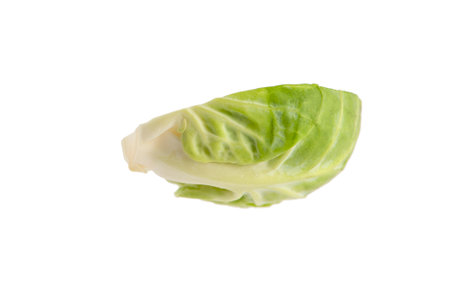 Brussels sprouts on a white background. Fresh small Brussels sprouts, cut in half, Brussels sprouts textureの写真素材