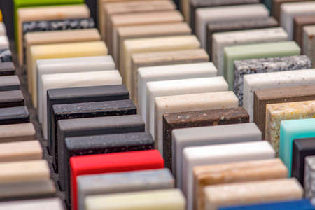 Samples of decorative artificial stone, close-up. Stone samples for kitchen countertops or bathroom,...
