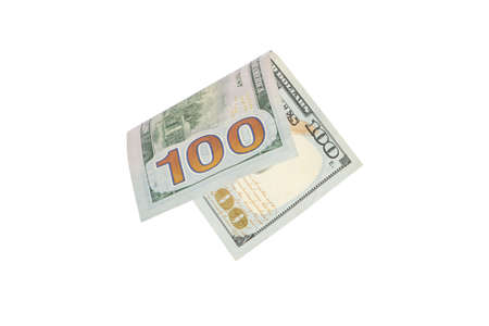 Isolate on white hundred dollar bills. American money folded in half, close-up.