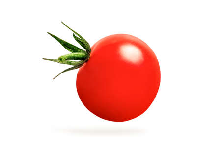 Cherry tomatoes isolate on white. one tomato hanging in close-up, casting a shadow.