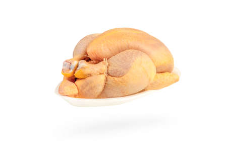 Raw corn chicken isolated on white background. The chicken carcass is packed in a white plastic...