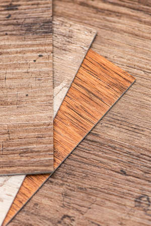 PVC industrial floors. Vinyl floors. The swatches are brown with a woody texture. Copy spaceの写真素材