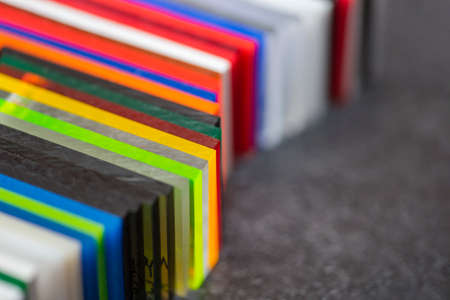 Multi-colored samples of organic glass. Colorful acrylic sheets plastic swatches, craft and...