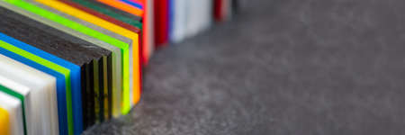 Multi-colored samples of organic glass. Colorful acrylic sheets plastic swatches, craft and decoration equipmentの写真素材