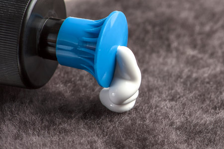 Paste for car polishing. Car body care. Polishing pads and polishing paste close-up.