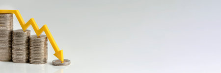 Inflation. The recession of the economy and the euro. The concept of economic collapse and the collapse of the stock exchange in the euro zone. Stacks of coins and a graph arrow pointing down.の写真素材