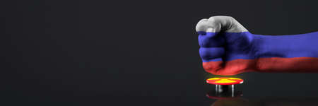 The threat of nuclear war. Russia threatens the world with nuclear weapons. A fist painted in the...