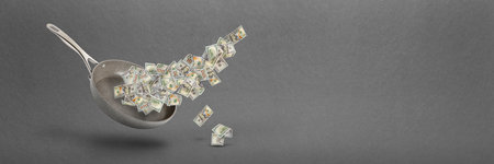 Rising food prices. The concept of rising cost of food. Money in a pot. Dollar bills fly over a...