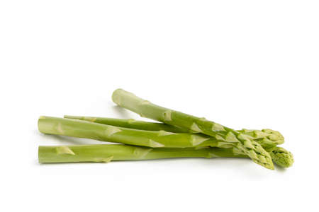 Fresh green asparagus on a white isolated background. Green asparagus isolate with shadow on white background.の写真素材