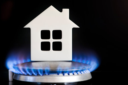 Heating season. The beginning of the heating season on natural gas. Concept, model of a house stands...