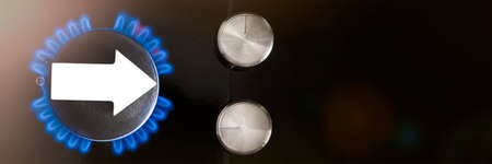 Gas price. Supply chains and the energy gas crisis. Gas stove with a burning flame and a graph arrow pointing upの写真素材