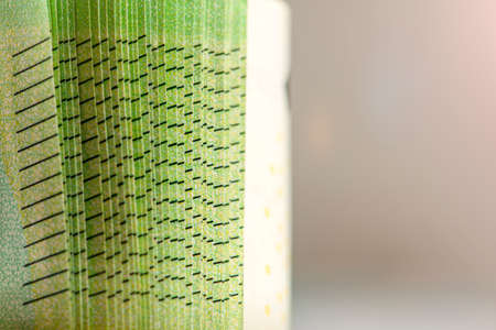 Close-up of a stack of paper bills, side view. Euro banknotes stacked on top of each other. Big pile...