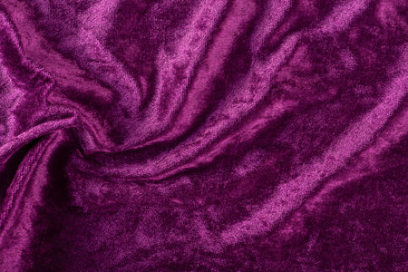 Beautiful purple silk satin background. Soft folds on a shiny fabric. Birthday, Christmas, Valentines Day. Luxury background with copy space for text, design, web banner.の写真素材