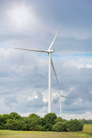 Green wind energy. Windmills for the production of renewable electricity. Windmills in the field,...