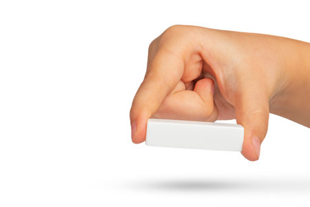 White minus symbol in hand. White mathematical symbol minus in hand on a white isolated background.の写真素材