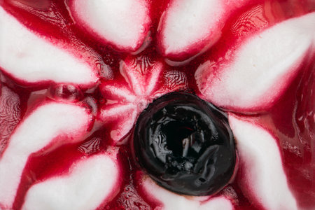Texture of cherry ice cream. Fresh and delicious ice cream with cherries is a tasty treat for children and adults.の写真素材