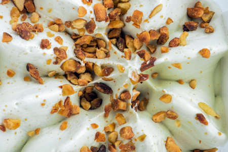 Texture of ice cream with pistachios. Ice cream closeup. The concept of treats for children and...