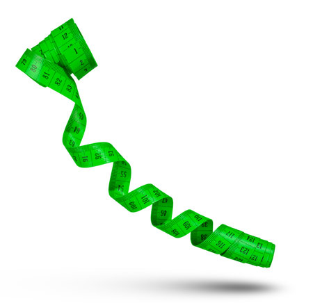 Measuring tape isolated on white background. Tape for measuring sizes in centimeters, green. The concept of diet, weight loss or distance measurement.の写真素材